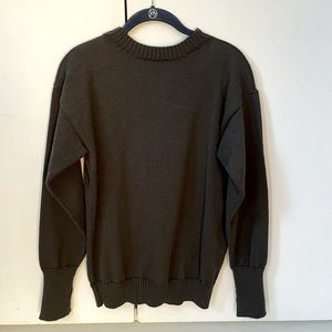Andersen-Andersen Seaman’s sweater in dark green with signature thumb holes.